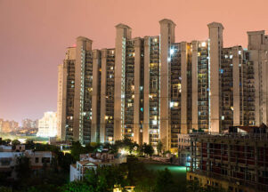 Highrise multistory apartments in Gurgaon India provide homes to much of the city's populationBalcony facing a highrise apartment building. These provide much of Gurgaon's housing solution